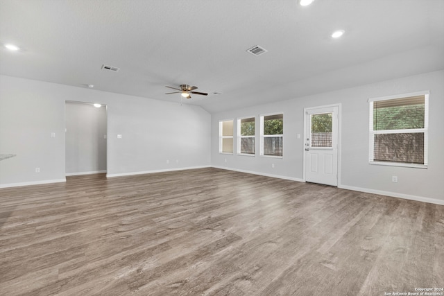 unfurnished living room with light hardwood / wood-style floors and ceiling fan