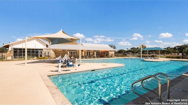 view of pool featuring a patio