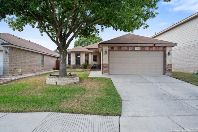 view of front of house featuring a front yard and a garage