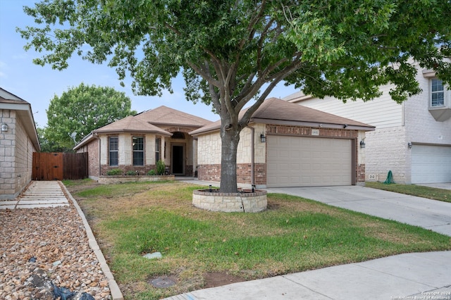 view of front facade featuring a garage and a front lawn