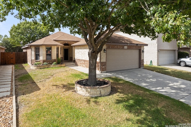 view of front facade with a garage and a front yard