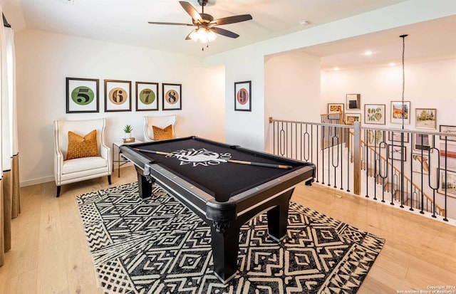 recreation room featuring ceiling fan, pool table, and hardwood / wood-style flooring