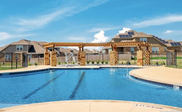 view of swimming pool featuring a pergola