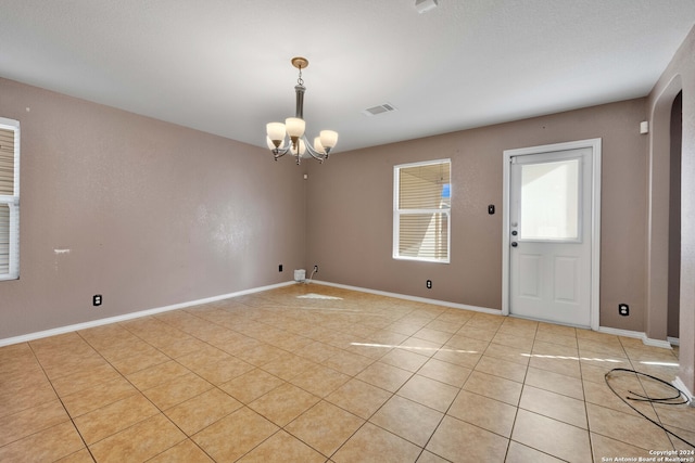 interior space featuring a chandelier