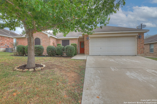 view of front of home featuring a garage and a front yard