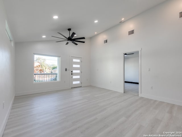 unfurnished living room featuring ceiling fan, light hardwood / wood-style flooring, and high vaulted ceiling