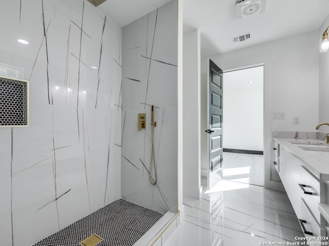 bathroom featuring vanity and a tile shower