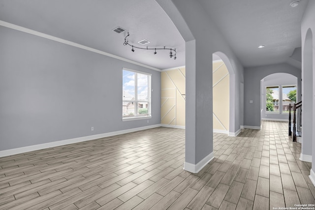 spare room with light hardwood / wood-style flooring and ornamental molding