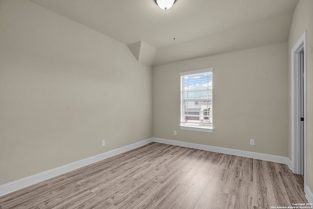 spare room featuring light wood-type flooring