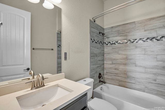 full bathroom with vanity, toilet, and tiled shower / bath