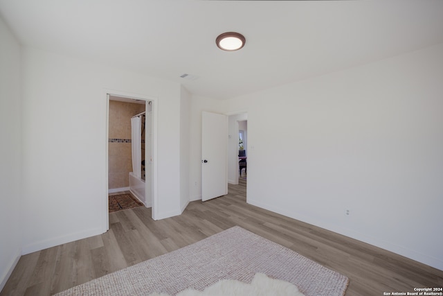 spare room featuring light hardwood / wood-style flooring