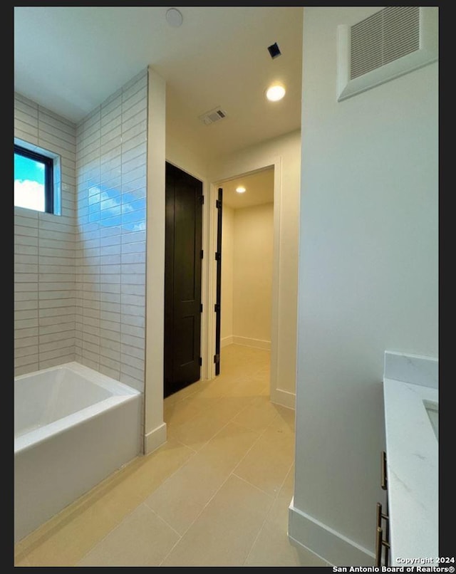 10899 S Hausman Rd Unit 204, San Antonio, TX 78249 - hallway featuring light tile patterned floors
