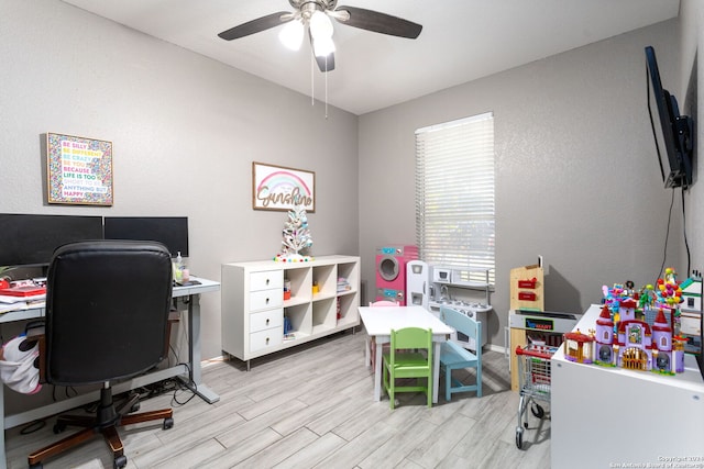 office space with ceiling fan and light hardwood / wood-style floors