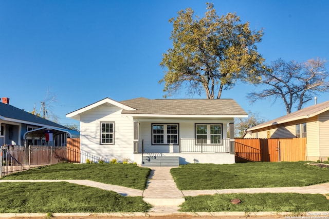 bungalow-style house with a porch and a front yard