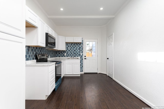 kitchen with dark hardwood / wood-style floors, decorative backsplash, ornamental molding, appliances with stainless steel finishes, and white cabinetry