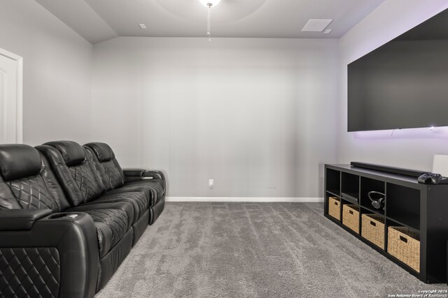 carpeted living room with vaulted ceiling