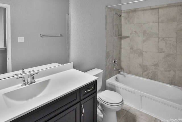 full bathroom featuring toilet, vanity, tile patterned floors, and tiled shower / bath