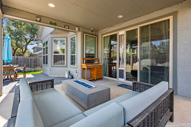 view of patio / terrace featuring an outdoor living space with a fire pit