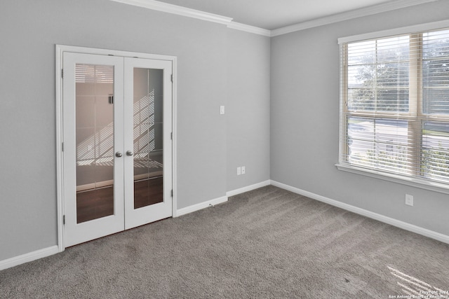 carpeted empty room with french doors, ornamental molding, and a healthy amount of sunlight