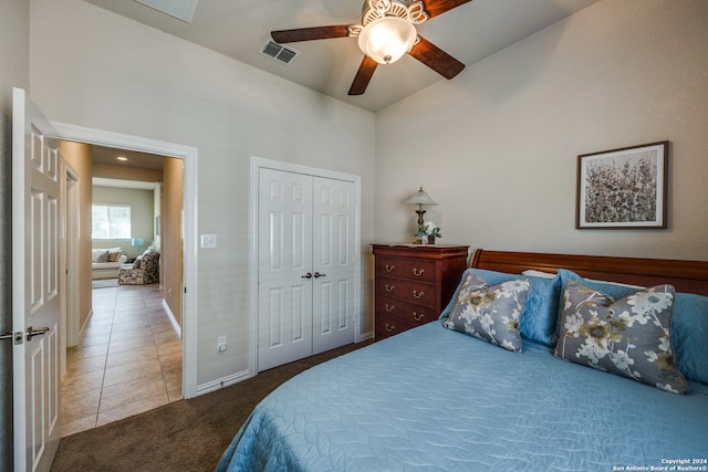 bedroom featuring a closet, tile patterned floors, and ceiling fan