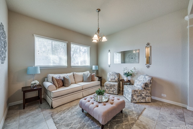 living room featuring a notable chandelier