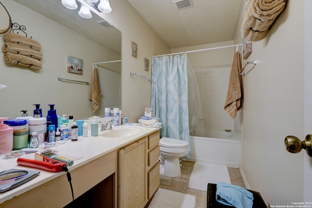 full bathroom featuring vanity, shower / bathtub combination with curtain, a textured ceiling, and toilet