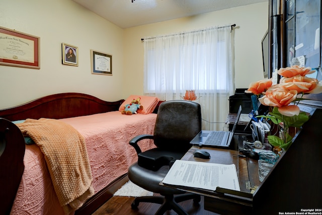 bedroom with wood-type flooring