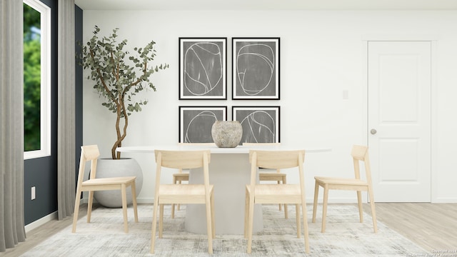 dining space with light wood-type flooring