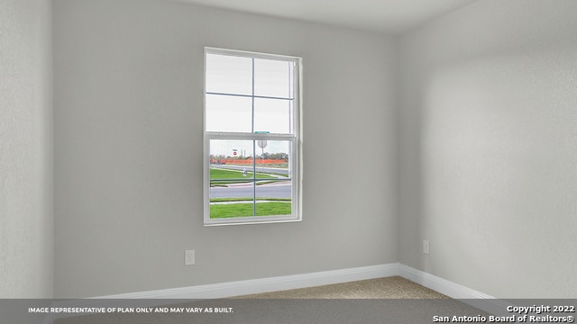 spare room featuring carpet floors