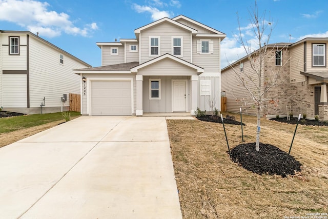 1205 Pacific Monarch, San Antonio, TX 78253 - traditional-style house featuring board and batten siding, driveway, an attached garage, a shingled roof, and a front lawn