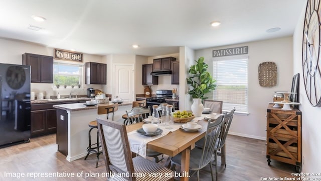 dining area with light hardwood / wood-style flooring