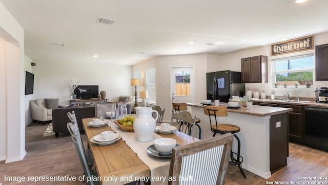 dining area with hardwood / wood-style floors