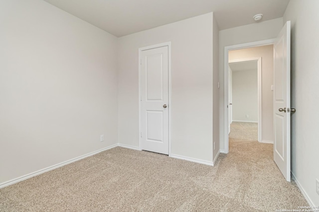 1205 Pacific Monarch, San Antonio, TX 78253 - unfurnished bedroom featuring light carpet and baseboards