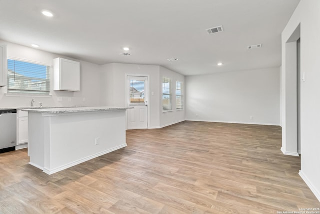 1205 Pacific Monarch, San Antonio, TX 78253 - kitchen with dishwasher, white cabinets, baseboards, light wood finished floors, and recessed lighting
