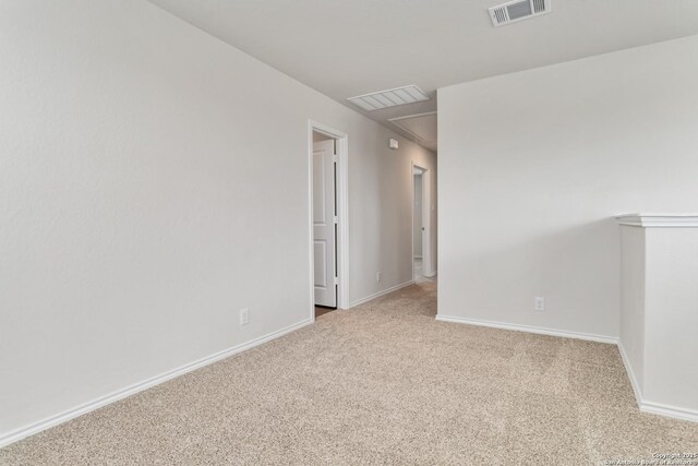 1205 Pacific Monarch, San Antonio, TX 78253 - carpeted empty room with baseboards and attic access