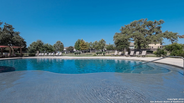 view of swimming pool featuring a patio