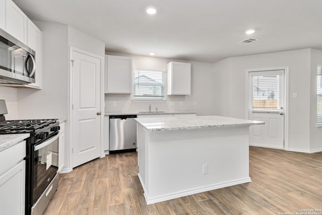1205 Pacific Monarch, San Antonio, TX 78253 - kitchen with appliances with stainless steel finishes, light wood finished floors, plenty of natural light, and recessed lighting