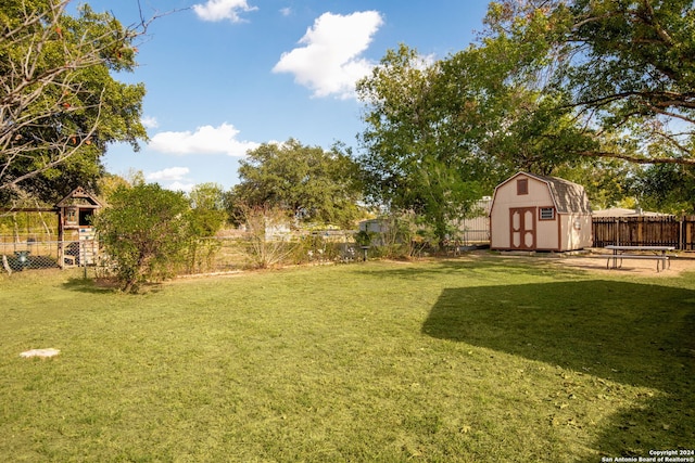 view of yard featuring a shed and a playground