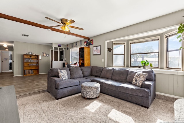 living room with ceiling fan and light wood-type flooring