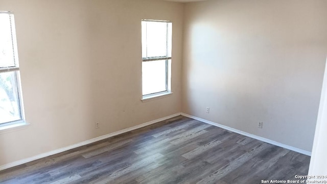 empty room featuring dark hardwood / wood-style floors