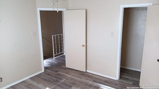 interior space with hardwood / wood-style floors and a closet