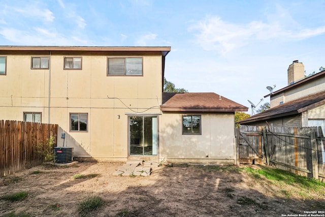 back of property with central AC unit