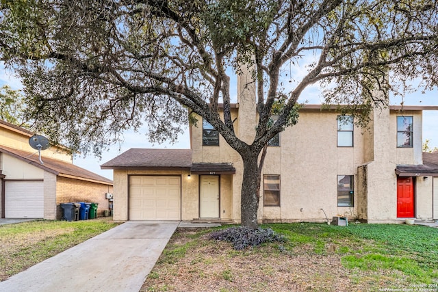 view of front of house with a front yard and central AC