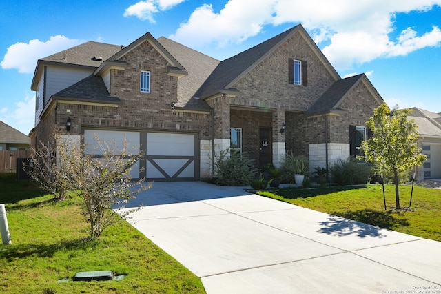 view of front facade with a garage and a front yard