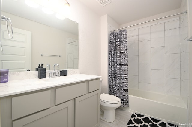 full bathroom featuring vanity, toilet, and shower / tub combo with curtain