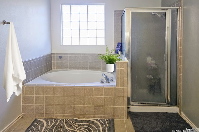 bathroom with tile patterned flooring and independent shower and bath