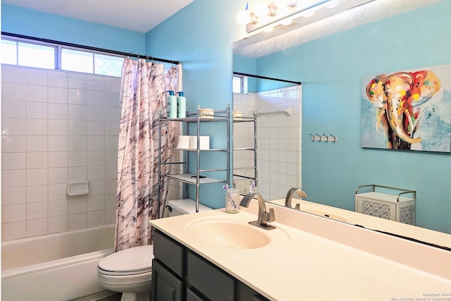 full bathroom with shower / bath combo with shower curtain, vanity, and toilet