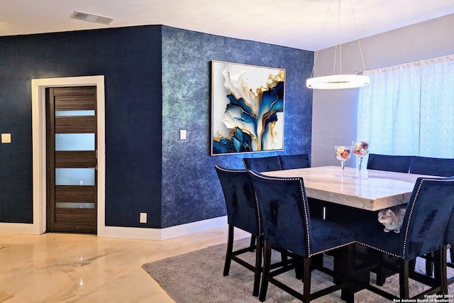 dining room with concrete floors