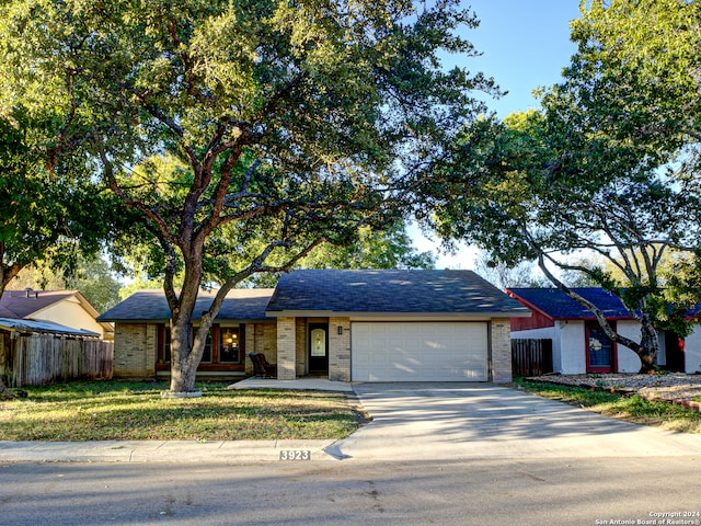 ranch-style house featuring a garage