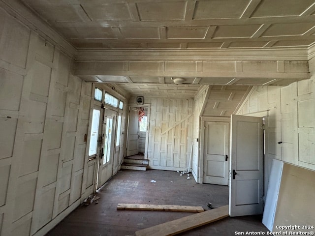 miscellaneous room featuring wooden walls